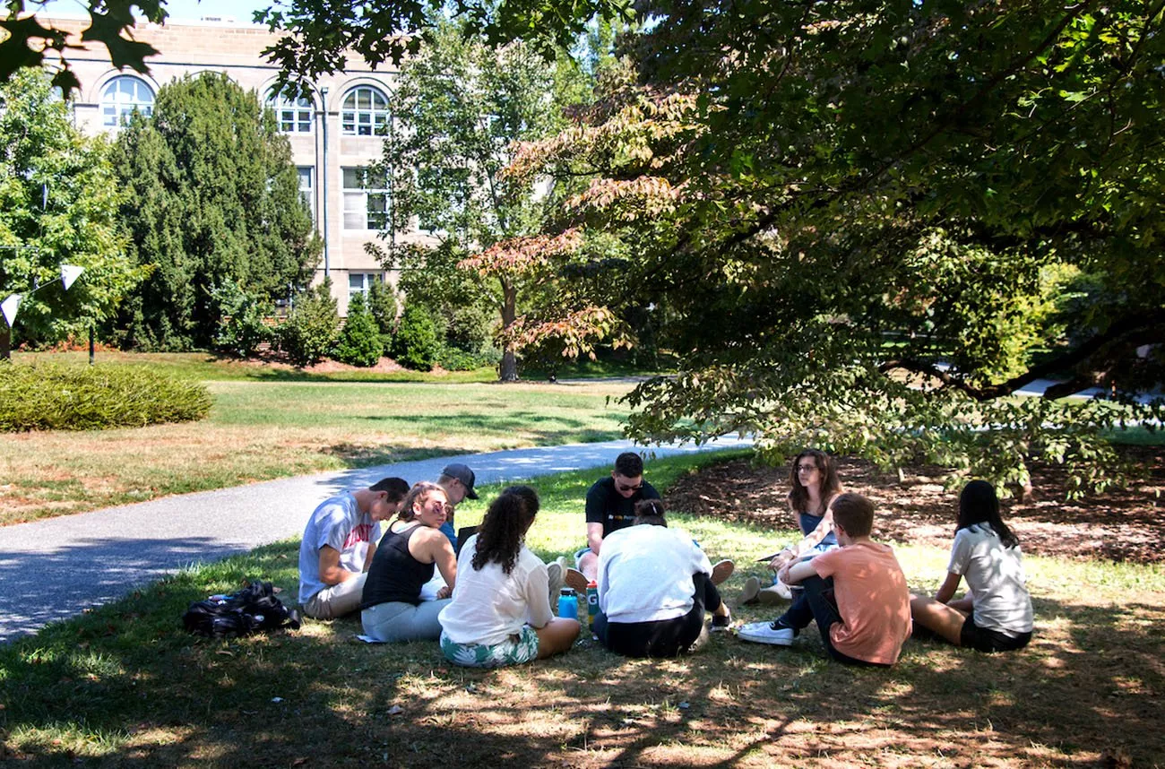 students talking in a circle